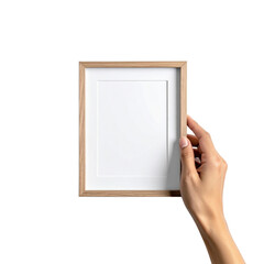 Hand holding a wooden picture frame with a blank white mat and paper cutout isolated on transparent background. PNG die-cut for advertising