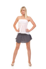Blonde woman in summer outfit posing on white background
