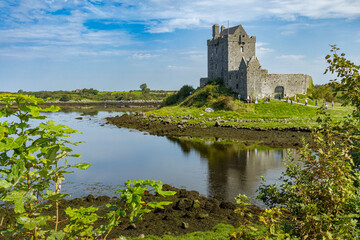 Dunguaire Castle on a sunny summer day, a 16th-century tower house on the southeastern shore of...
