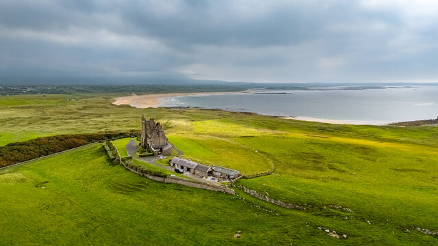 Aerial shot of Classiebawn Castle on a overcast day, an impressive 19zh century country manor in the Scottish Baronial style in County Sligo, Ireland