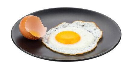 Fried egg with broken shell isolated on black plate cutout transparent png