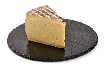 Tomme de Montagno Cheese Slice on Slate Plate, isolated on white background