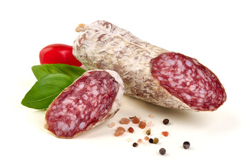 Fuet Salami on Black Slate with Tomatoes and Basil, isolated on white background