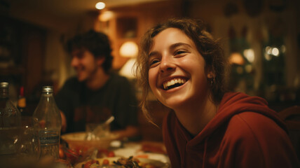 Family gathering shares joyful laughter around the dinner table at home