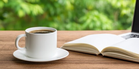 steaming cup of coffee sits next to an open book on a wooden table, surrounded by a lush green background, inviting relaxation and contemplation.