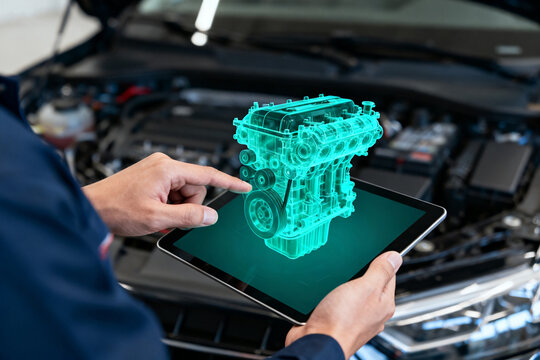 Mechanic using tablet with holographic engine model over open car hood