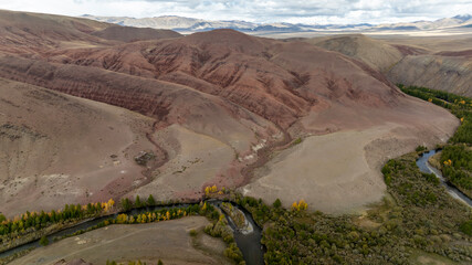 Unreal, ethereal landscapes of lakes and rivers on a sunny autumn day in the Altai foothills, captured by a drone