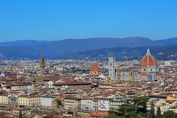 Obraz premium Florence in Italy with OLD PALACE and the Cathedral with Dome of Brunelleschi Architect and Italian Apennines Mountains in background