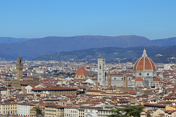 Florence in Italy with OLD PALACE and the Cathedral with Dome of Brunelleschi Architect and Italian Apennines Mountains in background