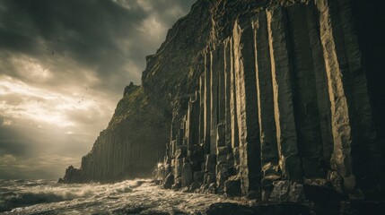 Basalt Columns on Rocky Coastline with Dramatic Sky