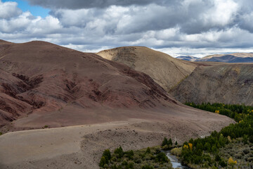 A beautiful autumn landscape with mountains and gorges in Altai, captured with a drone.
