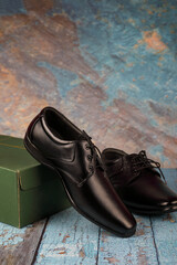 Classic leather formal Shoes isolated on a wooden table	
