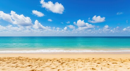Fototapeta premium Vibrant tropical beach scene with turquoise water and fluffy white clouds under a clear blue sky