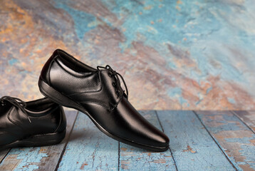 Classic leather formal Shoes isolated on a wooden table	
