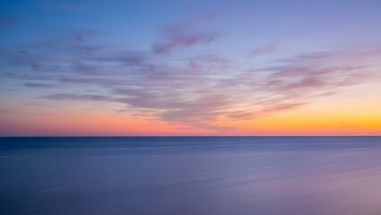 Naklejka premium Beautiful sea at sunset with colorful sky and clouds in the horizon line view panorama