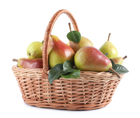 Fresh ripe pears with green leaves in wicker basket isolated on white