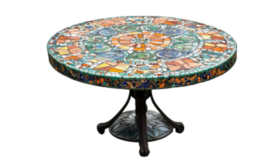 Round mosaic table with colorful ceramic and glass tiles arranged in an intricate concentric pattern on an ornate pedestal base.