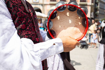 Galician musician holding a tambourine