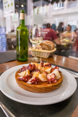 Polbo a feira, a traditional Galician octopus dish, in restaurant