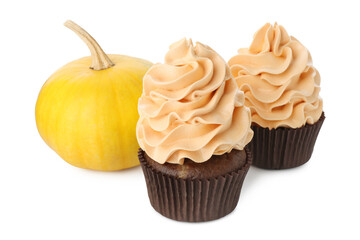 Delicious cupcakes with color cream and pumpkin isolated on white