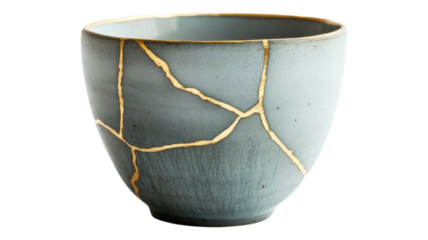 A close up of a ceramic bowl with gold kintsugi repair work