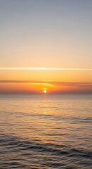 Obraz premium Sunset over calm water