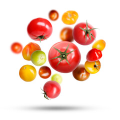 Different fresh tomatoes falling against white background