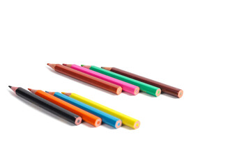 colorful arrangement of colored pencils on a white background.