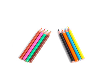 colorful arrangement of colored pencils on a white background.