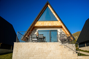 Wooden A-frame cabin in Durmitor mountains, wide shot