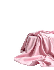 A draped pink blanket on a white surface