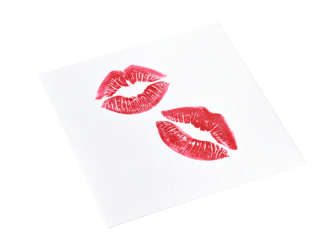 Two red lipstick kisses on white paper