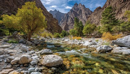 A crystalline stream meanders through a vibrant mountain gorge, flanked by lush greenery and towering peaks.