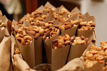 Assorted nuts in baskets at market