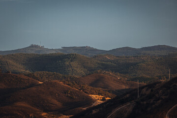 Big rock on background of dark sky. 