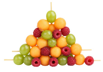 Isolated fruit skewers with cantaloupe balls, green grapes, and raspberries form triangle