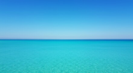 Vibrant blue ocean horizon under clear sky with copy space