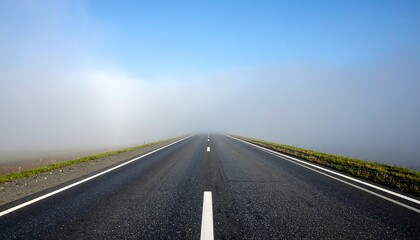 Fototapeta premium Empty road through a hazy morning