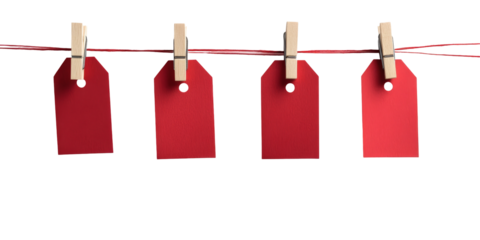 Four red blank tags hanging on a string with wooden clothespins