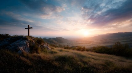 A solitary wooden cross stands on a hilltop at sunrise overlooking a serene landscape bathed in golden light
