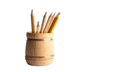 Wooden pencils of various colors are stored in a glass or cup on a white background, perfect for school, art, or the office