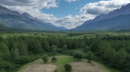 Breathtaking mountain vista with lush green forest and dramatic sky perfect for travel, nature, and outdoor adventure campaigns