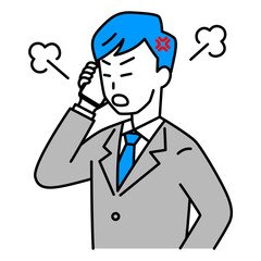 スマートフォンでの通話で怒るスーツの男性