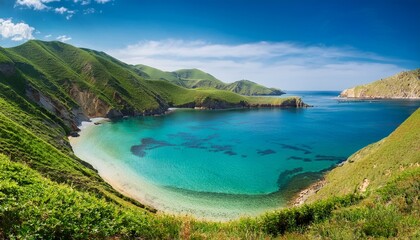 Fototapeta premium turquoise bay calm waters green hills turquoise water