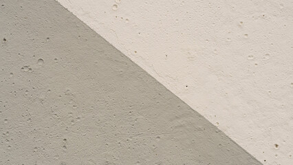 Fototapeta premium Light and dark plaster background diagonal