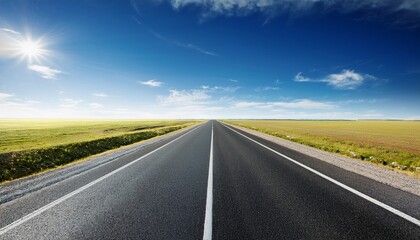Naklejka premium vast empty asphalt road stretches to the horizon under a clear bright sky creating a minimalist and expansive landscape image