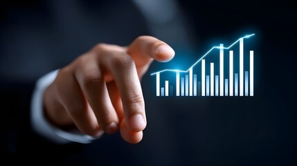 A close-up view of a businessman's hand interacting with a holographic graph displaying data and business growth trends on a futuristic digital interface.