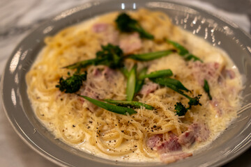 Bacon with pepper, cream spaghetti served on plate