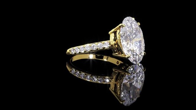 close up gold oval diamond wedding ring on black background  luxury jewelry video