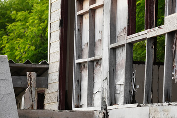 Abandoned house with broken walls and structure.
